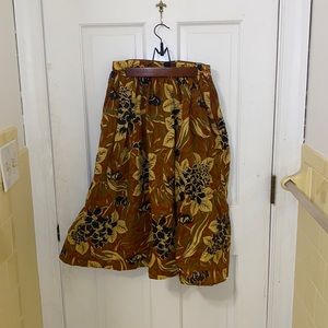 Brownish orange skirt with floral motifs
